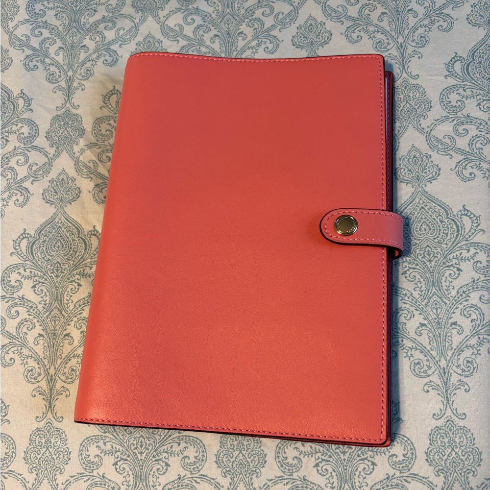 Coach notebook. Color gold/taffy.